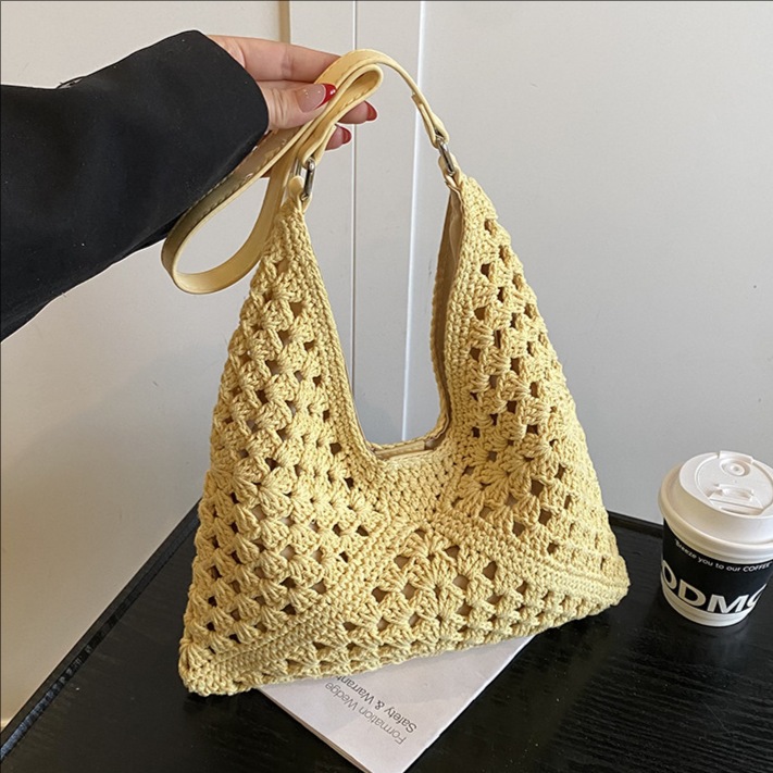 Hollowed-out best-selling woven large-capacity bucket bag for women 2025 new style seaside vacation beach straw woven versatile single-shoulder bag full figure