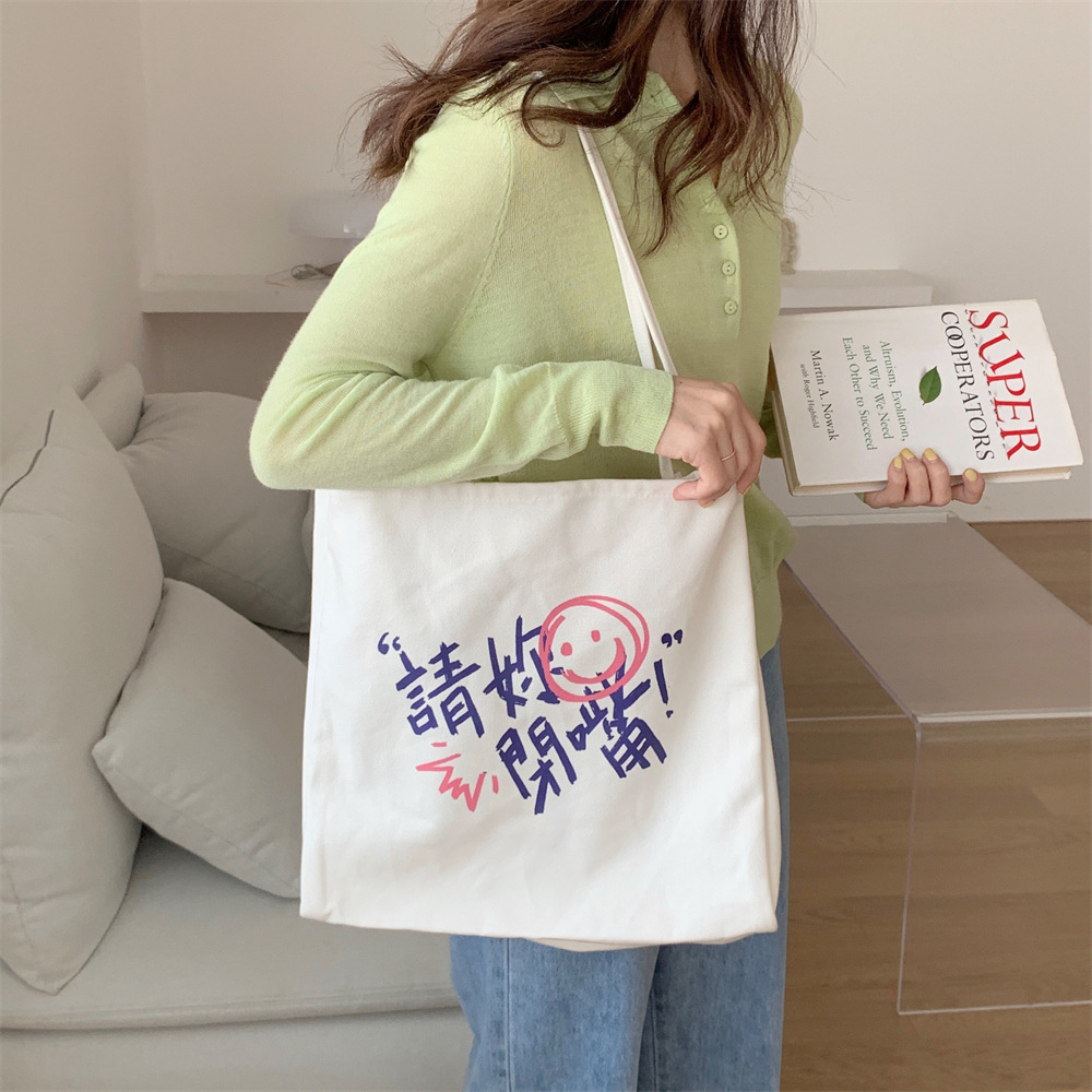 The new 14172 personalized printed large-capacity canvas bag is a student schoolbag and a single-shoulder bag for going shopping full figure