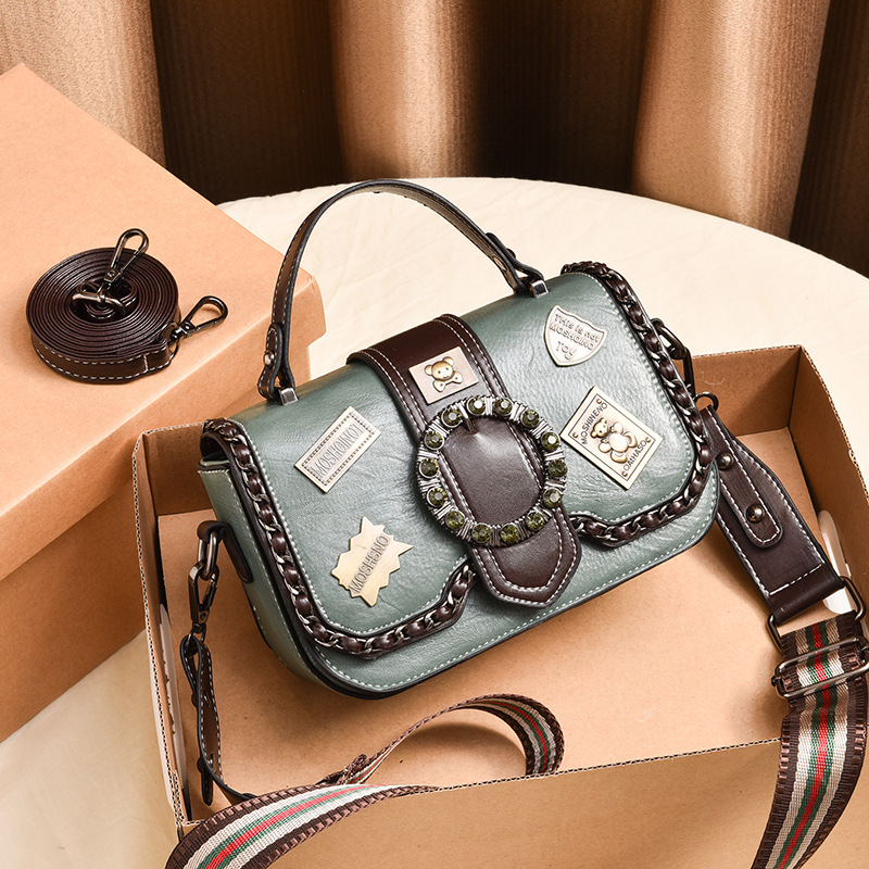 The 2022 new fashionable women's bag, a small square bag with printed badges and diagonal crosses, has become a bestseller in live-streaming on Douyin and Kuaishou details Picture