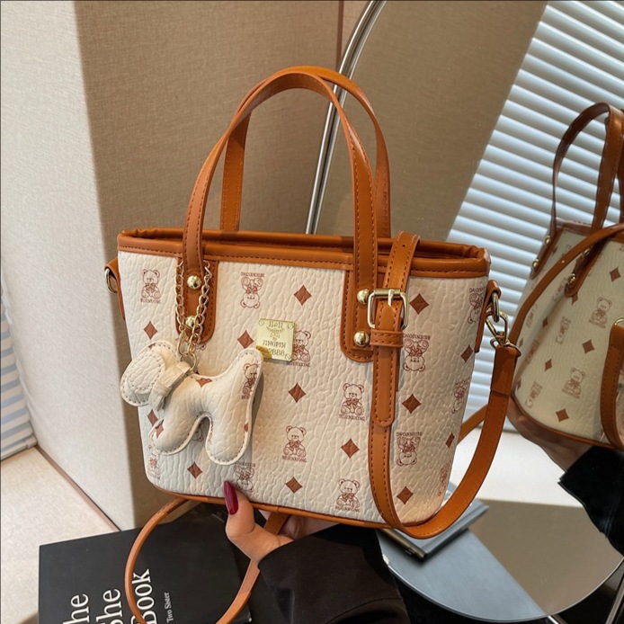 The 2025 new niche cartoon-printed hand-held bucket bag is a versatile, fashionable and trendy large-capacity single-shoulder crossbody bag for women full figure