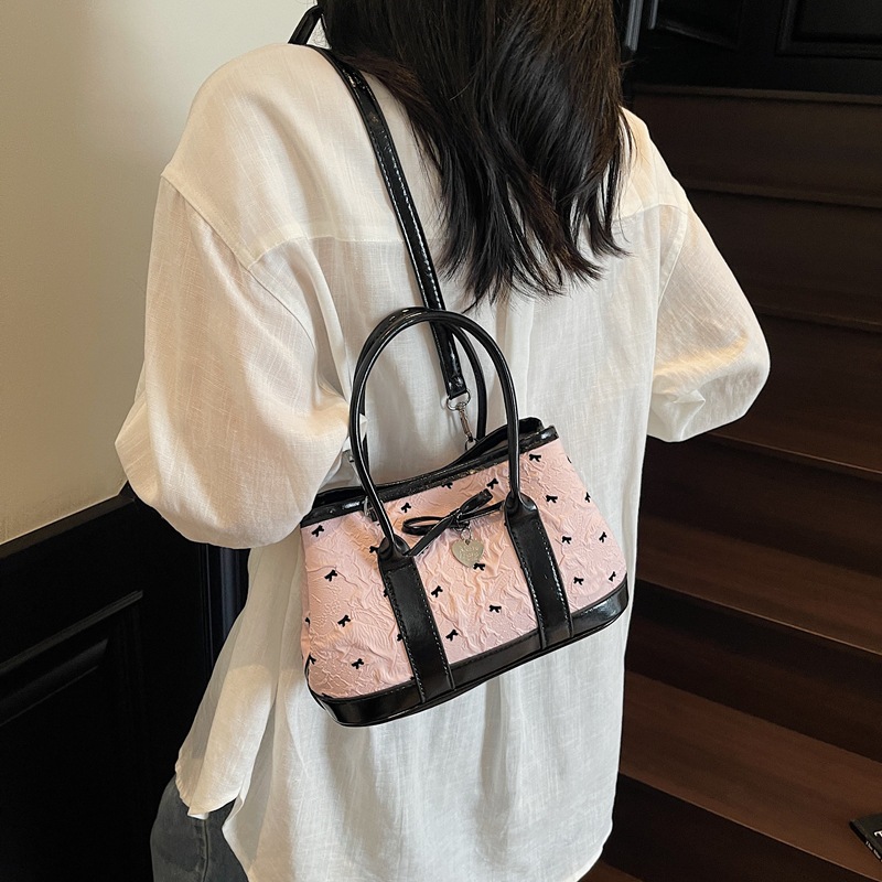 A niche high-end handbag, 2025 new style bow bucket bag, printed color-blocking single-shoulder bag, stylish crossbody bag details Picture