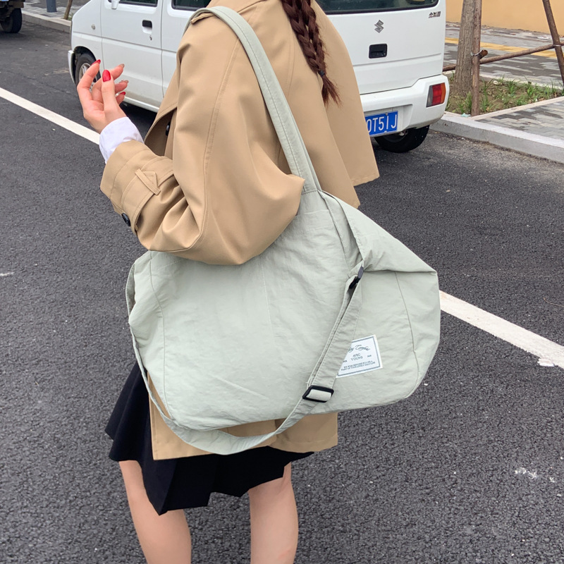 2025 New Japanese casual single-shoulder crossbody bag, women's large-capacity canvas bag, commuter tote bag, versatile underarm bag details Picture