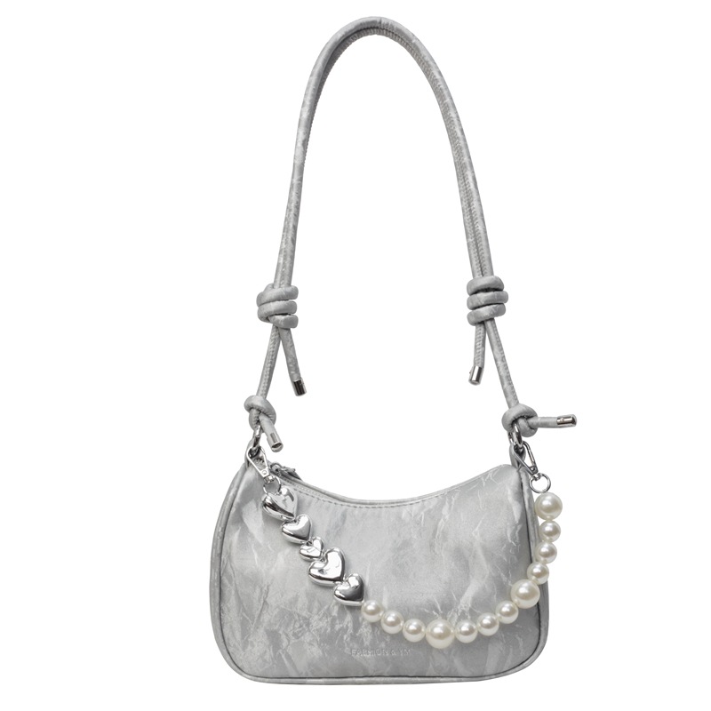 The new underarm bag for women in 2025 features a fashionable and niche design. This year, a solid-colored pearl versatile single-shoulder crossbody bag is in fashion Item Picture