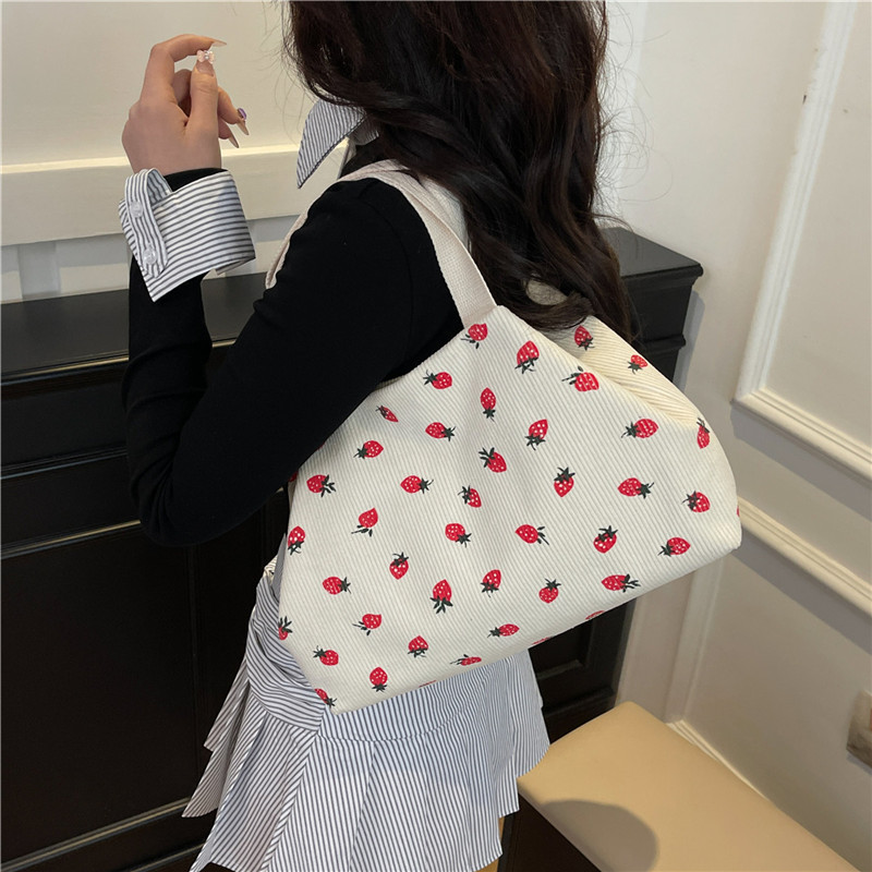 A large-capacity, simple and fashionable school-style personalized single-shoulder bag for commuting, a new spring 2025 hand-held tote bag details Picture
