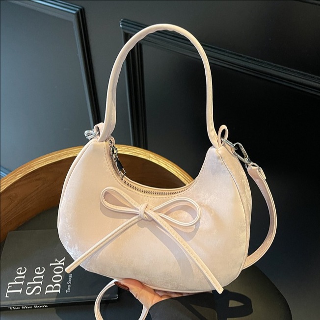 Simple solid color bow hand-held dumpling bag for women 2025 Summer new casual, fashionable and versatile underarm single-shoulder bag full figure