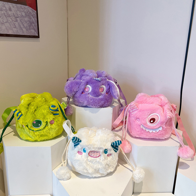 Wholesale of new Japanese-style cartoon soft and cute little monster plush drawstring bag, adorable ball ball drawstring bucket crossbody backpack full figure