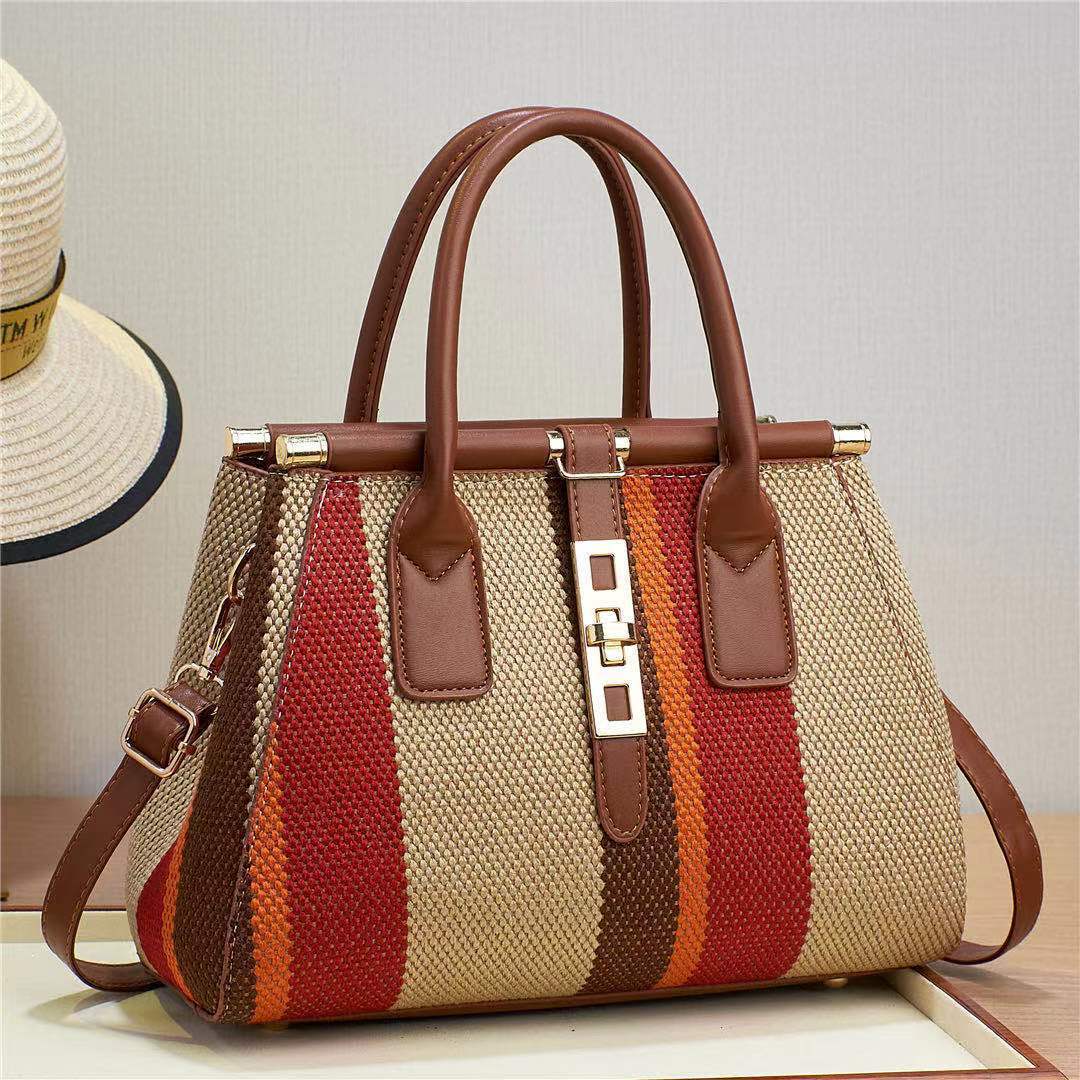 The 2023 new style of women's bag made of faux woven canvas material is noble and fashionable, with contrasting colors. It is a large-capacity cross-border bag for single-shoulder, crossbody and hand-carry full figure