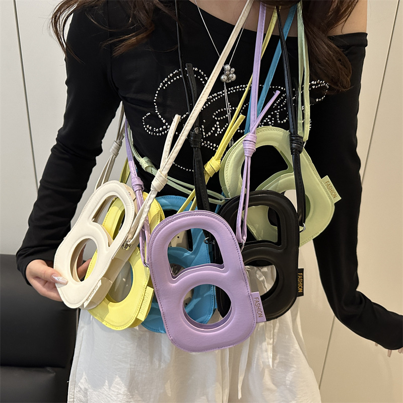 2025 Summer New candy-colored mobile phone bag, personalized women's crossbody bag, trendy and unique hollowed-out single-shoulder bag, small bag Application Scenario