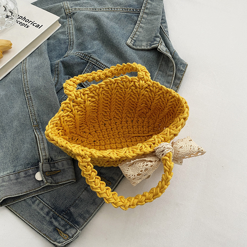 Summer straw woven bag, women's stylish bow hand-held bucket bag, trendy silk scarf, beach vacation woven bag Application Scenario