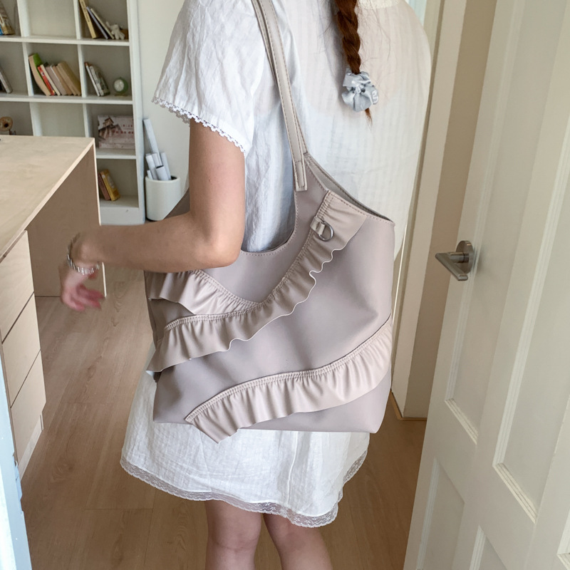 2025 New large-capacity tote bag, versatile bucket bag, stylish single-shoulder bag, fashionable underarm bag, solid-color women's bag details Picture