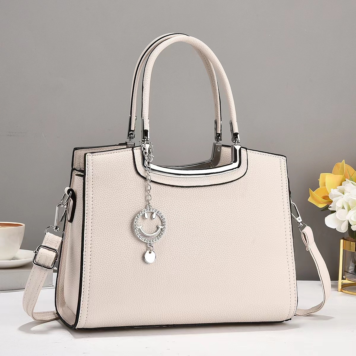 The new macaron handbag is a fashionable and trendy cross-border versatile women's bag with a high-end feel. It features a large capacity single-shoulder bag and a crossbody bag full figure