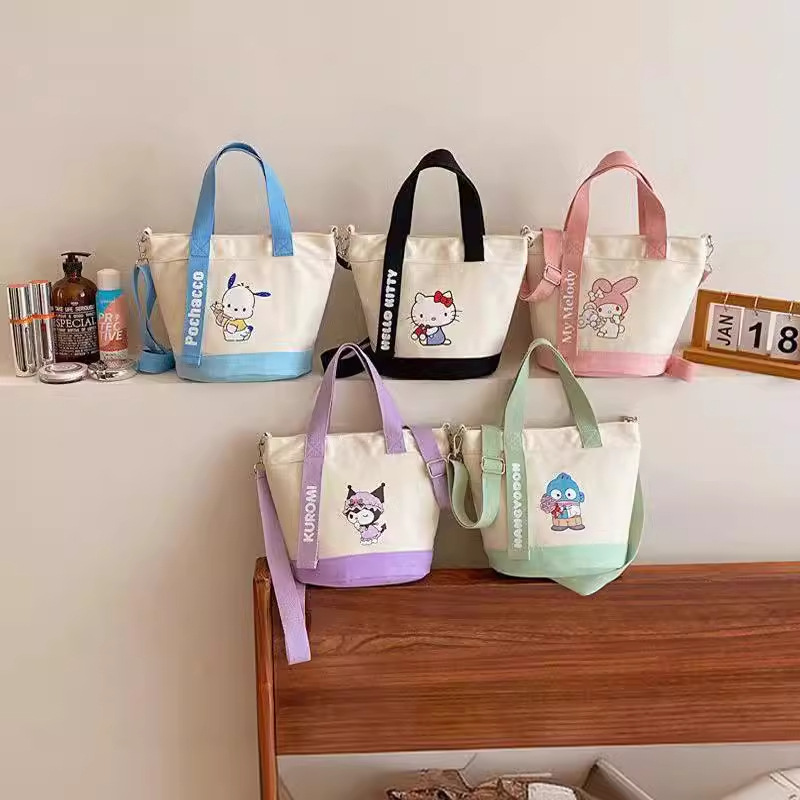 New cartoon canvas hand-held shoulder crossbody bag, cute office commuting document bag, bucket bag manufacturer wholesale version full figure