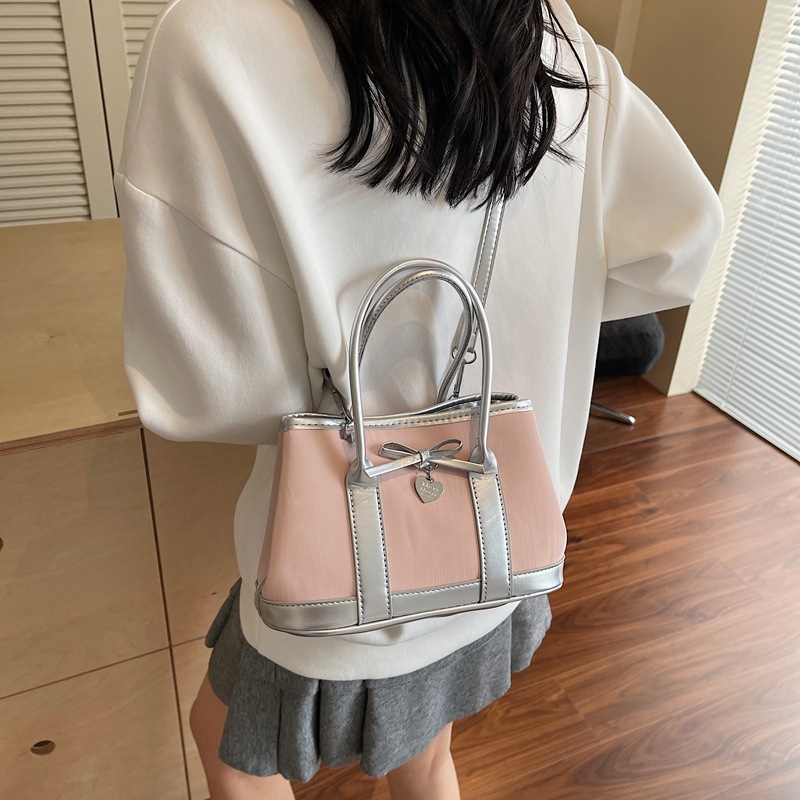 A niche high-end handbag, 2025 new style bow bucket bag, printed color-blocking single-shoulder bag, stylish crossbody bag Application Scenario