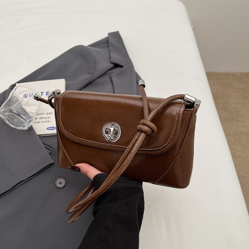 This is a new, stylish and versatile single-shoulder crossbody bag for women in 2025, featuring a light luxury texture and lock buckle. It is a high-end commuting bag Specification drawing