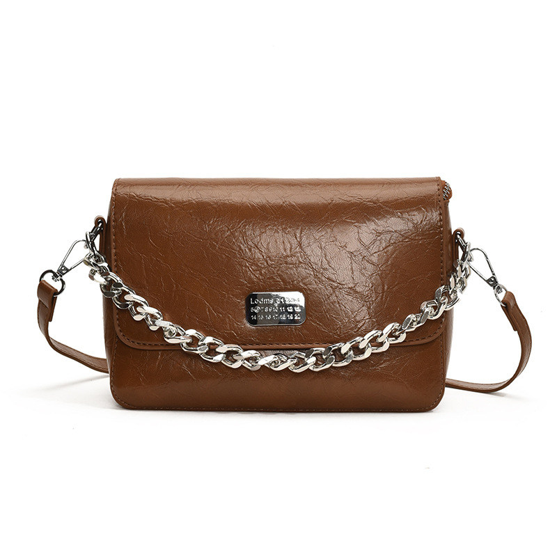 A new 2025 women's handbag with a light luxury and niche design, featuring a high-end texture. It is a single-shoulder crossbody bag with a chain and a small square bag for commuting Item Picture