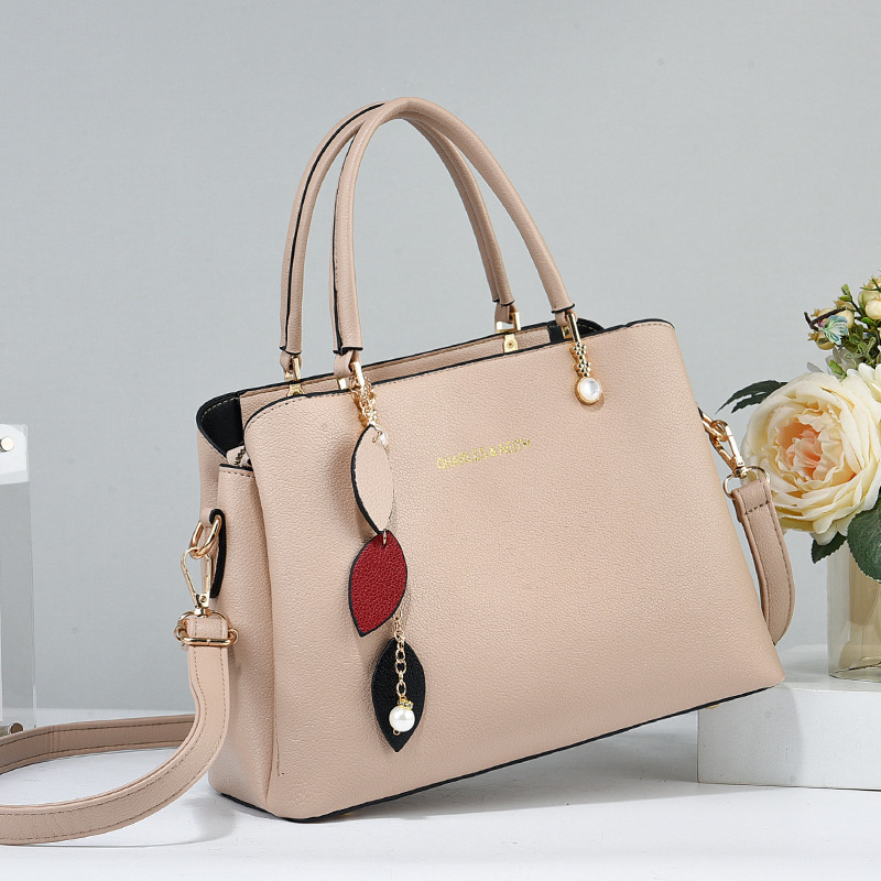 The 2025 new style of ladies' hand-held handbag is elegant, fashionable and stylish. The large-capacity single-shoulder bag for mothers is simple and fashionable details Picture