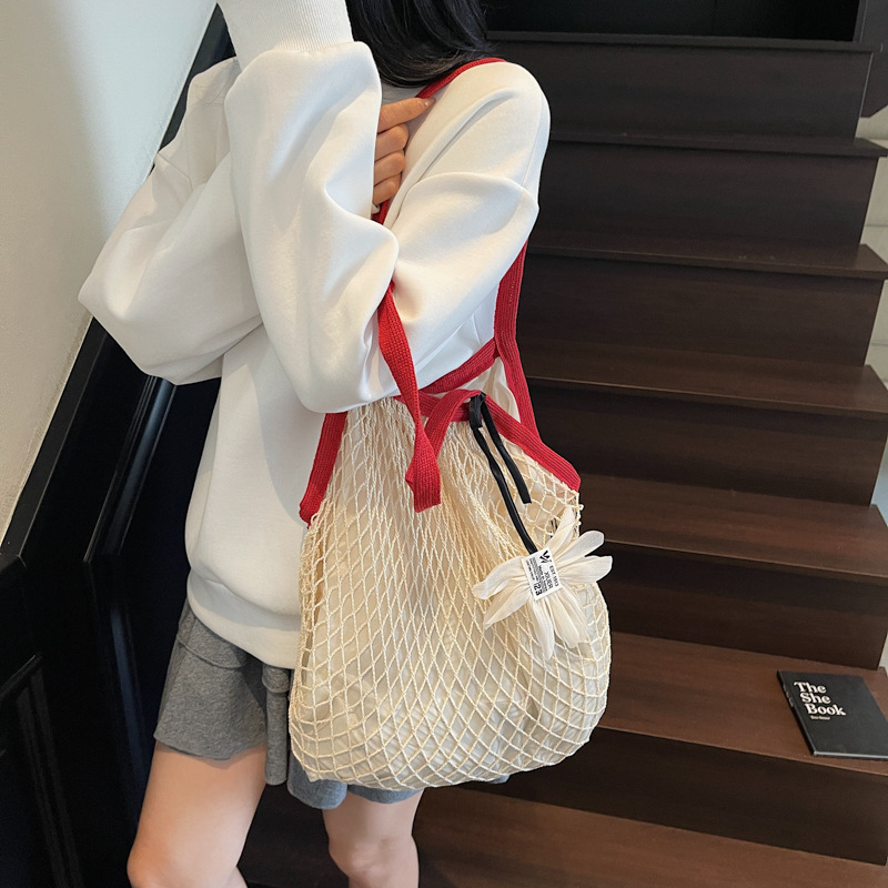 Trendy underarm bag, simple bucket bag, hollowed-out large capacity single-shoulder bag, new summer 2025 style, stylish knitted underarm bag details Picture