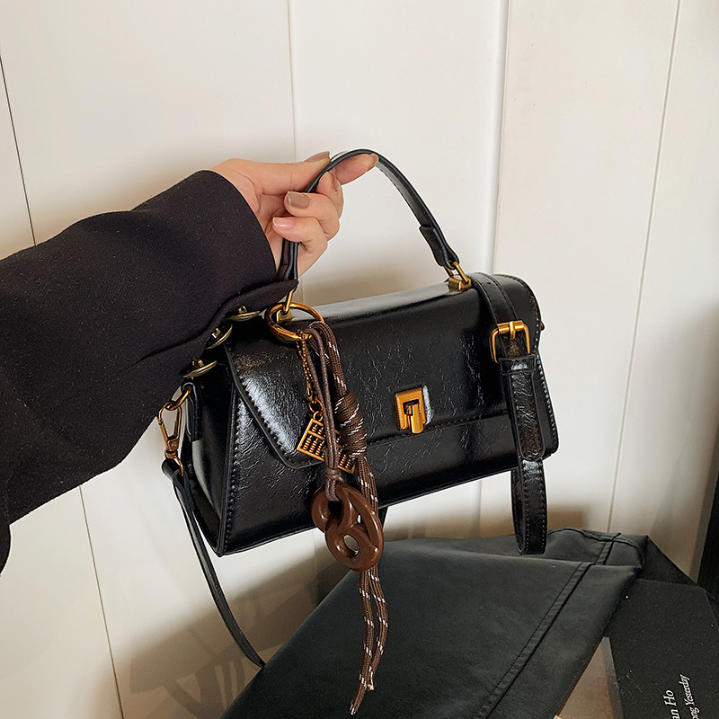 This year, the oil wax leather small bags for women are in vogue. The 2025 new style is a high-end hand-held small square bag and a retro casual crossbody bag details Picture