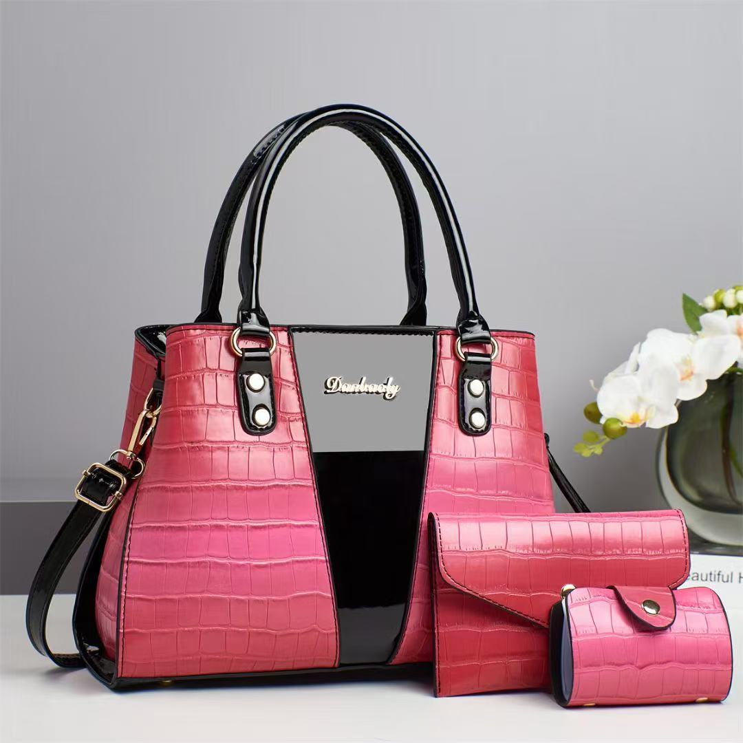 This is a large-capacity, fashionable and versatile three-piece handbag set for women's trade. It features crocodile texture and embossed patterns, with a large capacity and a stylish look Application Scenario
