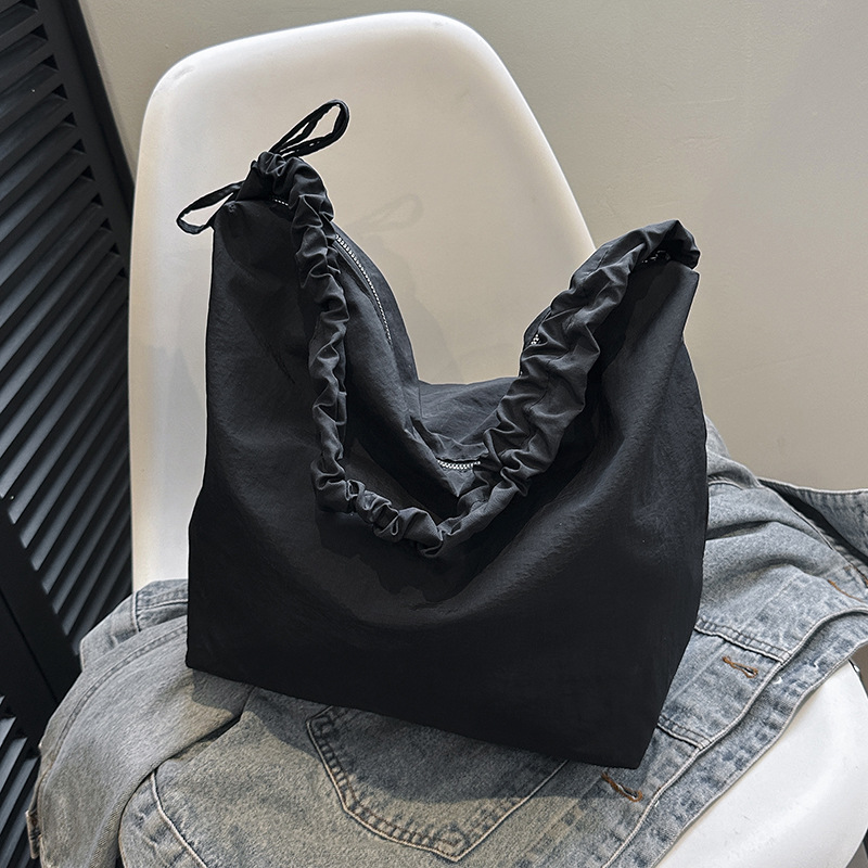 Cloud-shaped pleated drawstring shoulder strap canvas dumpling bag solid color simple and laid-back style commuting versatile single-shoulder crossbody bag for women full figure