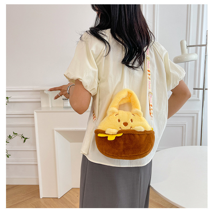 A new cartoon plush toy bag with a large capacity, a claw machine, a doll bag, and a girlish, hand-held, side-crossing birthday gift details Picture