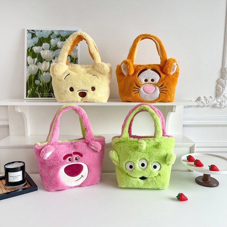The new plush bag for women, the double-bread bag, the soft-hearted cosmetic bag, the handbag, the strawberry bear, and the three-eyed monster cartoon bag full figure
