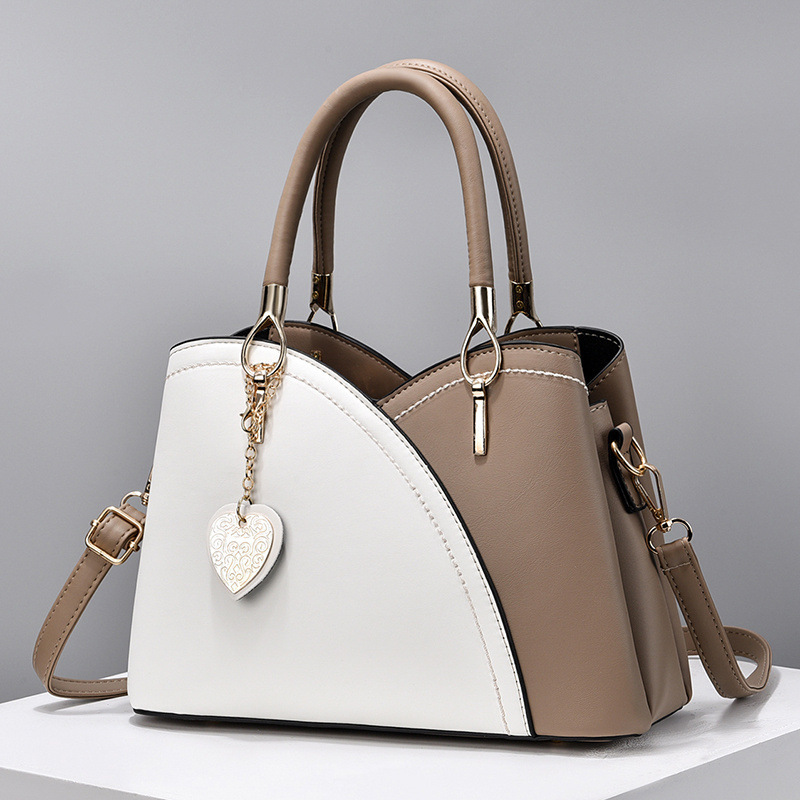 The 2022 new color-blocked fashionable commuter women's bag, a trendy single-shoulder, crossbody, hand-held tote large bag for cross-border trade Application Scenario