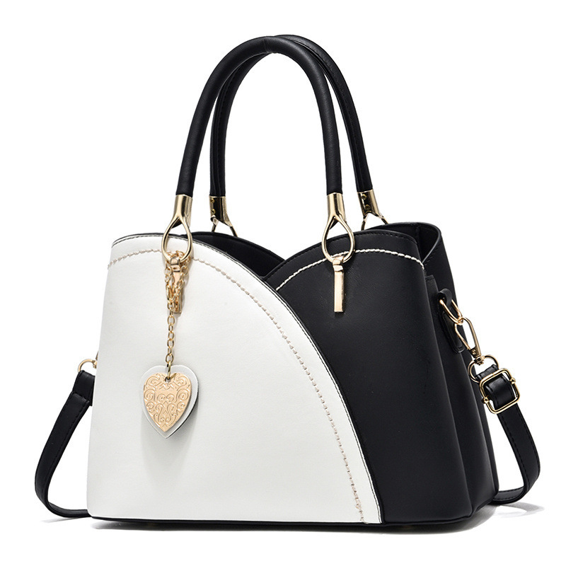 The 2022 new color-blocked fashionable commuter women's bag, a trendy single-shoulder, crossbody, hand-held tote large bag for cross-border trade Item Picture