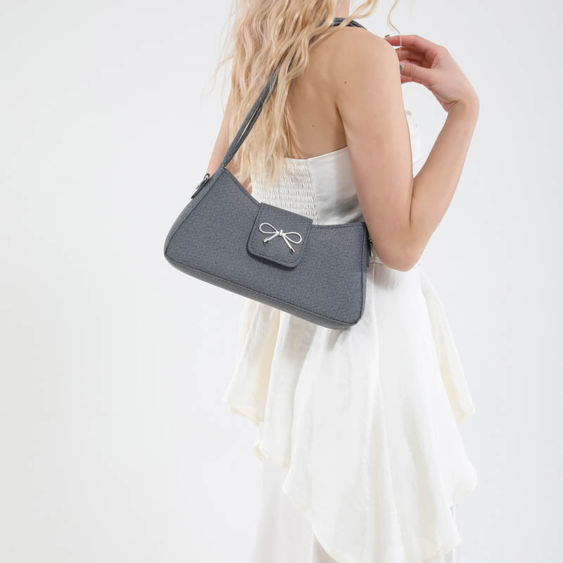 2025 New Korean-style, niche, high-end, versatile commuter baguette bag, minimalist bow, single-shoulder, underarm bag for women details Picture
