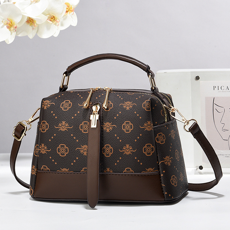 The 2024 new large-capacity printed and color-blocking pillow bag is a popular single-shoulder handbag for women's commuting this year full figure