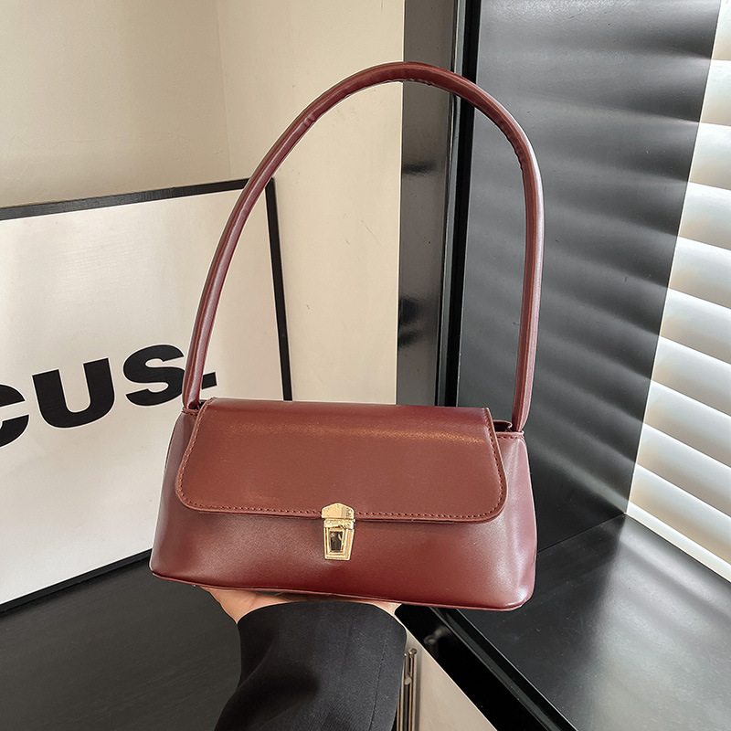 New 2025 Women's simple, fashionable, retro lock, large capacity, elegant hand-held, single-shoulder baguette, underarm bag full figure