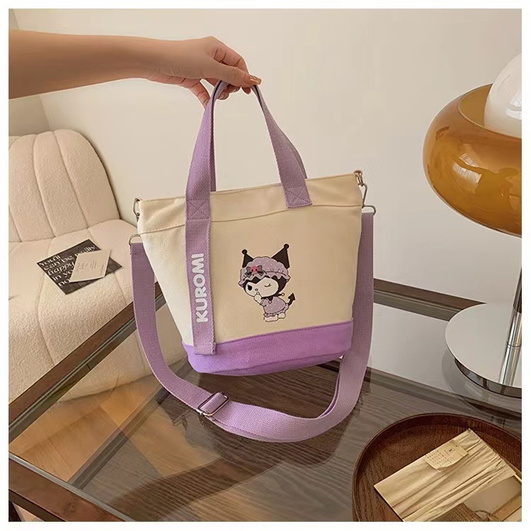 New cartoon canvas hand-held shoulder crossbody bag, cute office commuting document bag, bucket bag manufacturer wholesale version Application Scenario