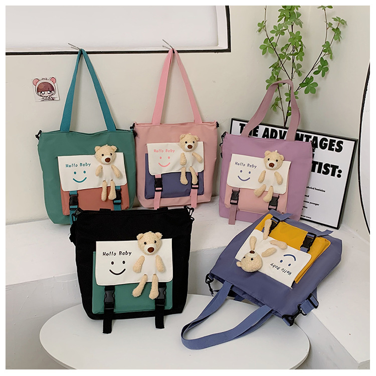 A simple and cute tote bag in Harajuku style, a large-capacity hand-held crossbody bag, a fashionable and casual student bag for class, a single-shoulder bag for girls full figure