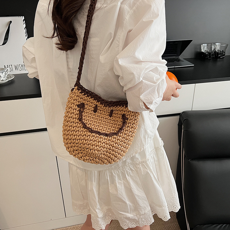 2025 New style simple bucket bag, niche women's bag, smiling knitted bag, single-shoulder bag for going out, and crossbody bag for seaside travel details Picture