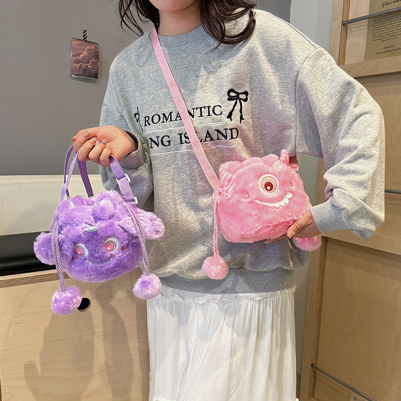 Wholesale of new Japanese-style cartoon soft and cute little monster plush drawstring bag, adorable ball ball drawstring bucket crossbody backpack details Picture