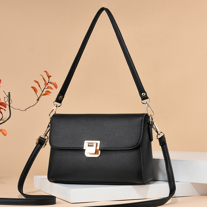 The new 2025 simple crossbody bag with lychee pattern for middle-aged moms is a must-have for shopping and grocery shopping. It's a trendy lock shoulder bag full figure