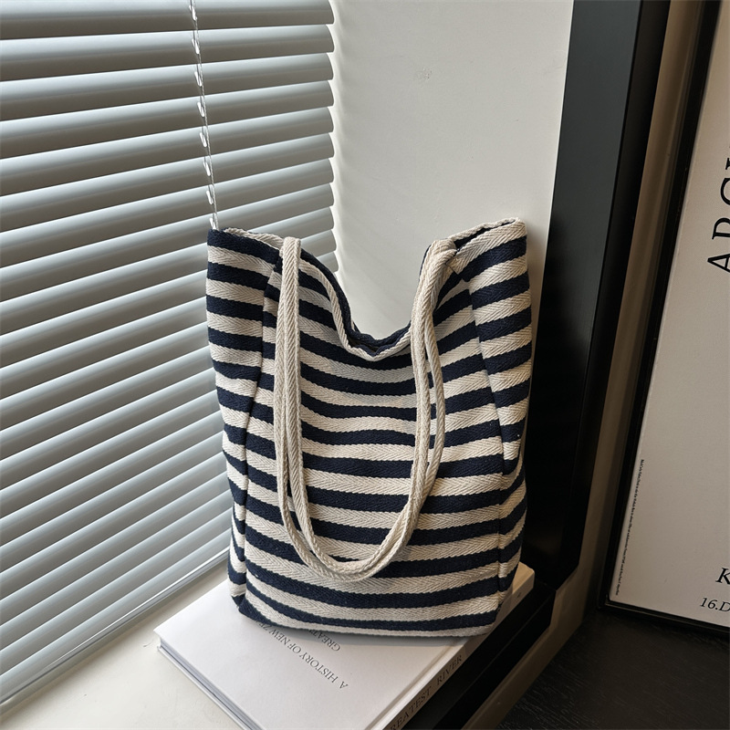 Korean-style artistic striped canvas bag 2024, casual, simple, large-capacity, laid-back style rope hand-held shoulder tote bag full figure