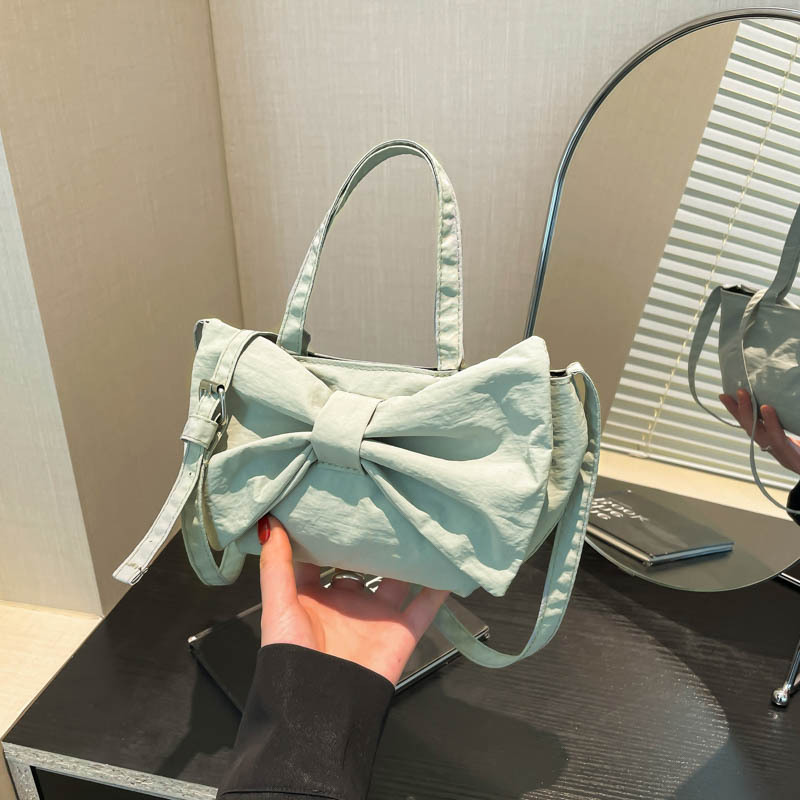 This high-end nylon fabric bow handbag is a new, niche design for women's summer 2025 commuting single-shoulder bag full figure