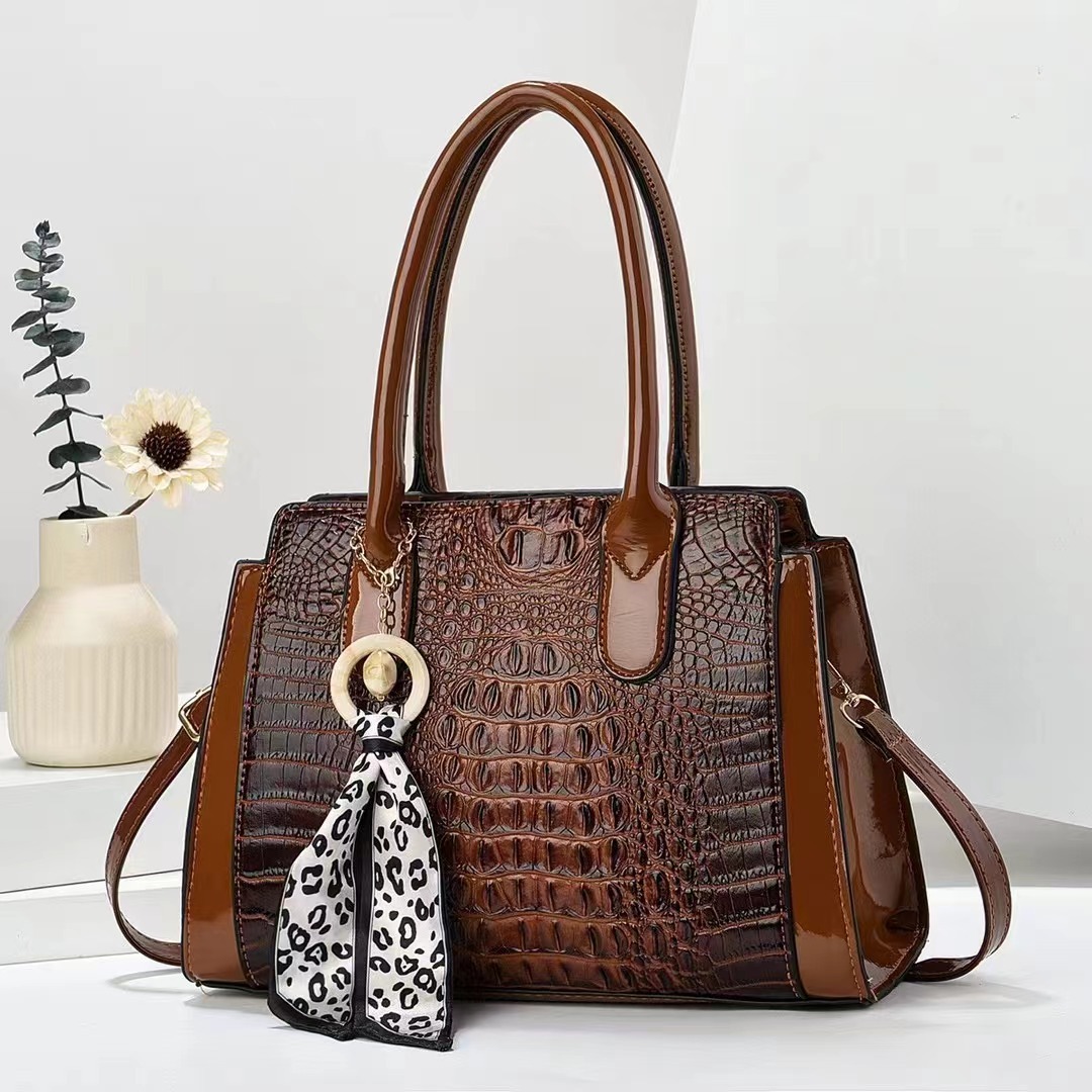 The 2024 new crocodile print handbag is simple and elegant. It is a single-shoulder crossbody women's bag with a large capacity and a stylish look details Picture
