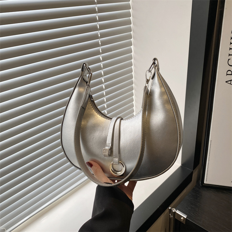 Simple and fashionable crescent-shaped bag for women, 2025 new Korean solid color niche design single-shoulder bag, elegant commuting crossbody bag full figure
