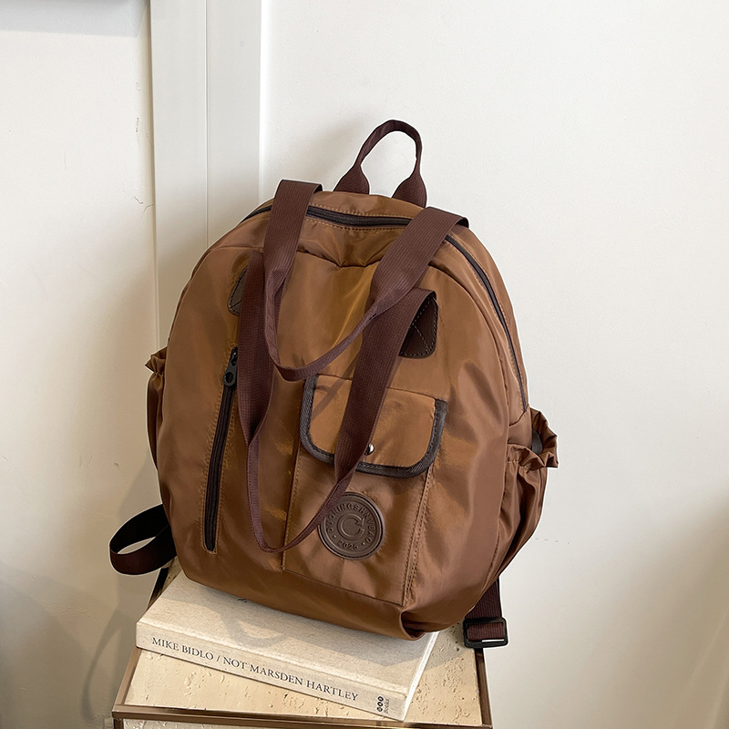 New autumn/Winter 2024 niche design, large-capacity, lightweight and simple backpack, high-quality hand-held shoulder crossbody bag full figure
