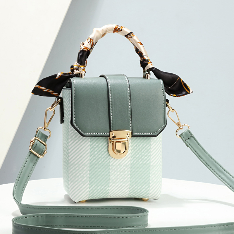 The checkered mobile phone bag is a high-end crossbody bag for women. It's a trendy 2023 summer mini bag for women and a small crossbody bag for mobile phones full figure