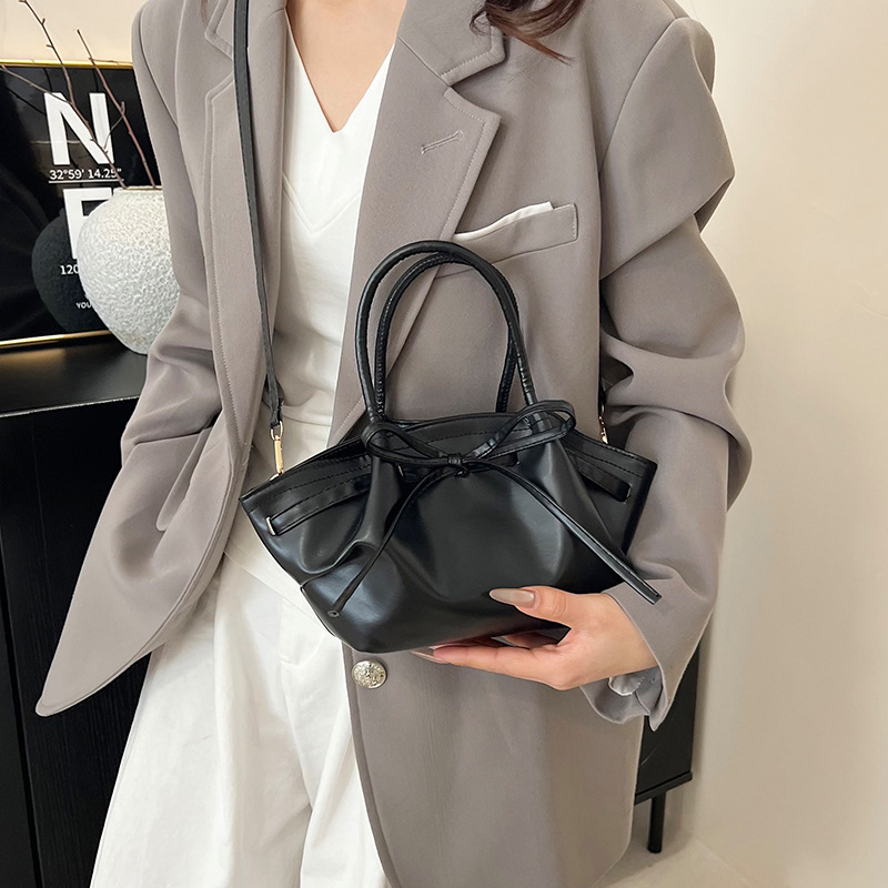 Korean niche hand-held vegetable basket bag for women's spring 2025 new trendy and fashionable bucket bag with bow crossbody details Picture