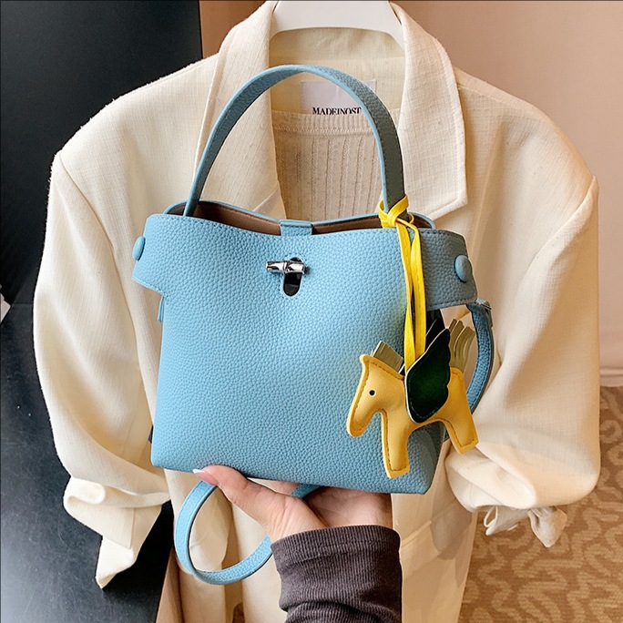 The 2025 new Korean-style high-end macaron hand-held small square bag is a versatile and fashionable single-shoulder crossbody bag for women's daily commuting full figure