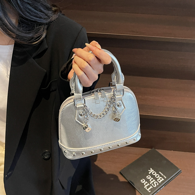 2025 New niche design, high-end champagne rivet hand-held shell bag, fashionable and stylish for women, single-shoulder crossbody bag details Picture