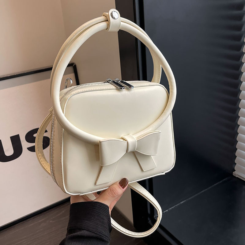 This is a new 2024 trendy, sweet and fashionable handbag with a bow and a small square. It is a versatile solid color single-shoulder crossbody bag full figure