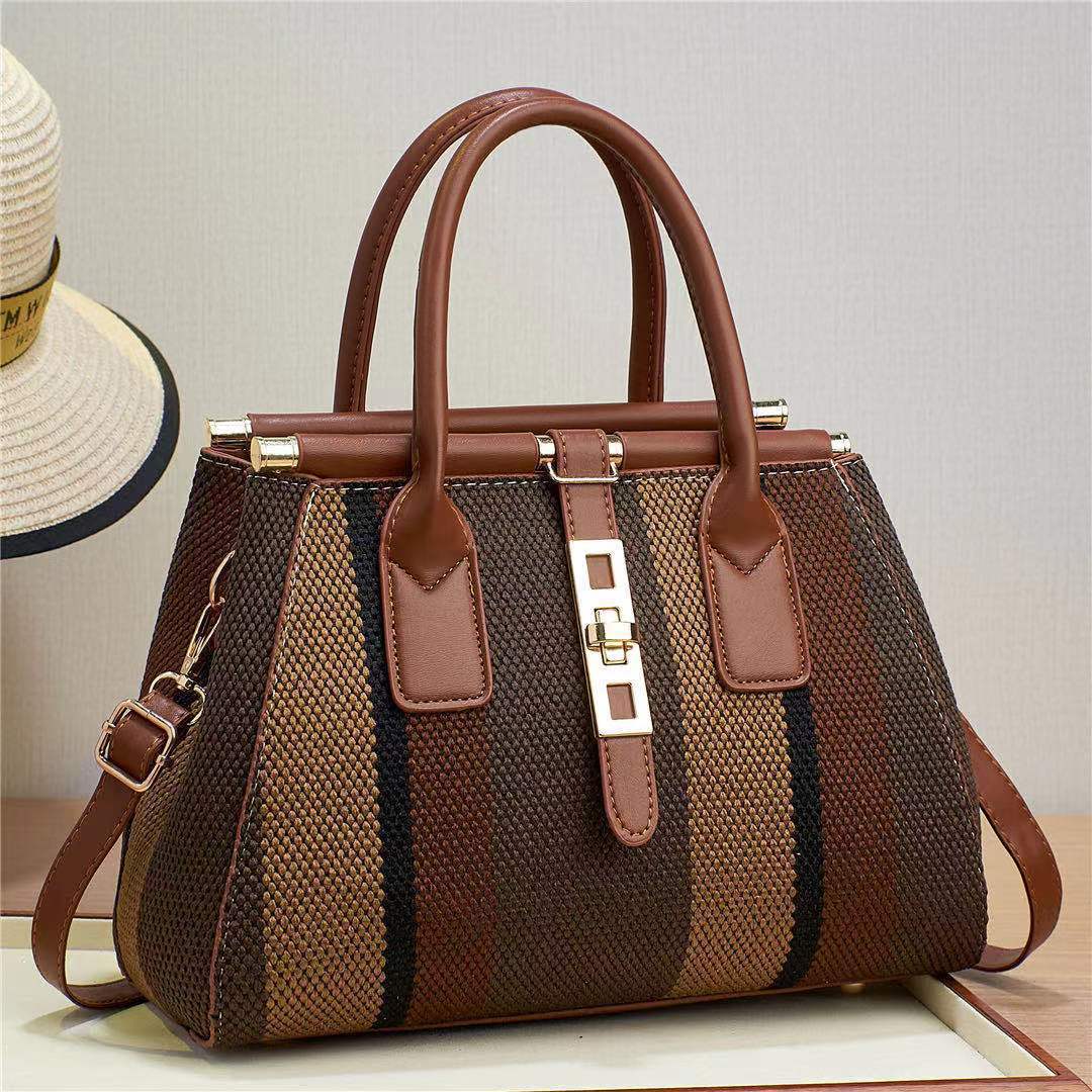 The 2023 new style of women's bag made of faux woven canvas material is noble and fashionable, with contrasting colors. It is a large-capacity cross-border bag for single-shoulder, crossbody and hand-carry details Picture