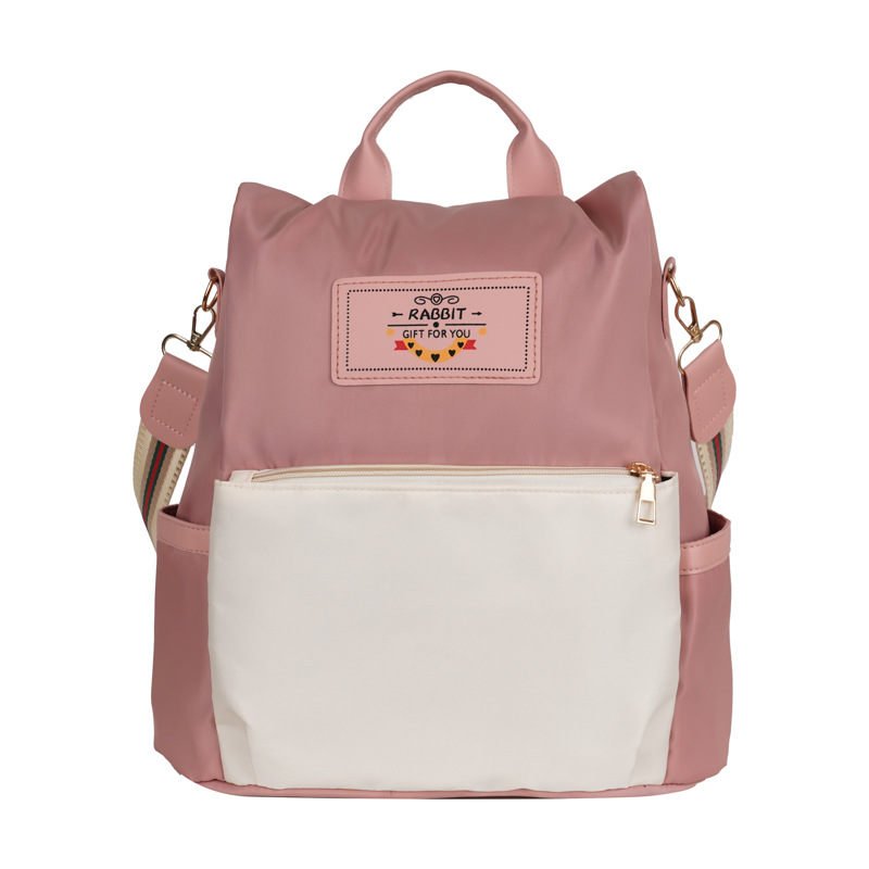A new 2025 Korean student commuting backpack with a unique color-blocking and patchwork design Item Picture