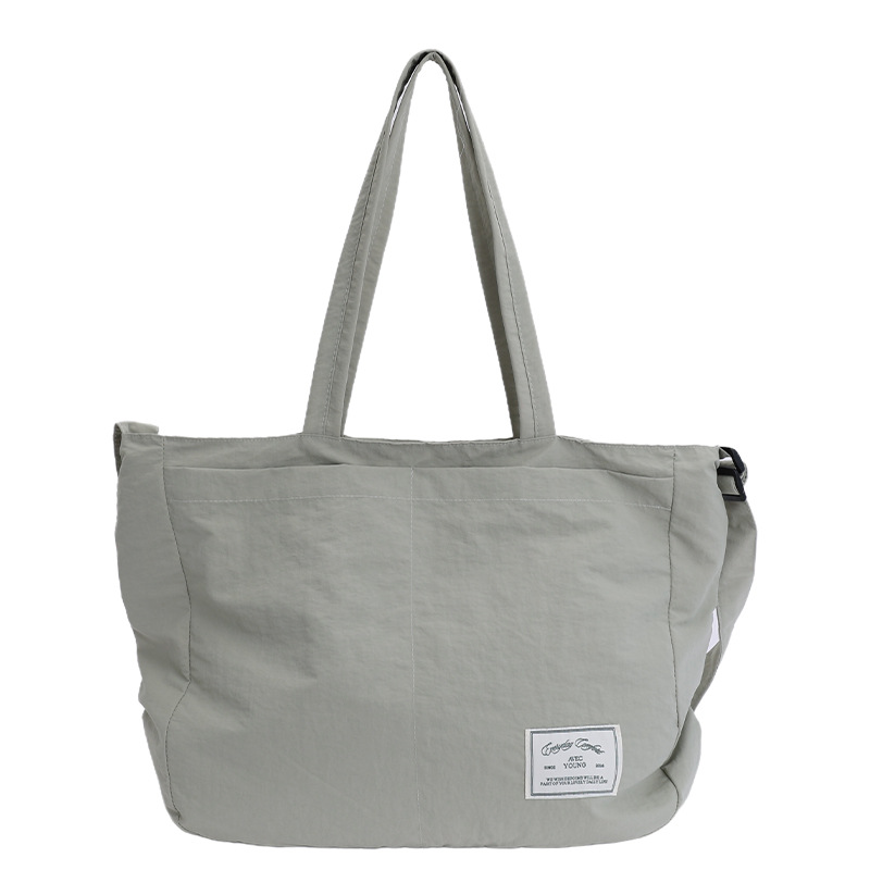 2025 New Japanese casual single-shoulder crossbody bag, women's large-capacity canvas bag, commuter tote bag, versatile underarm bag Item Picture