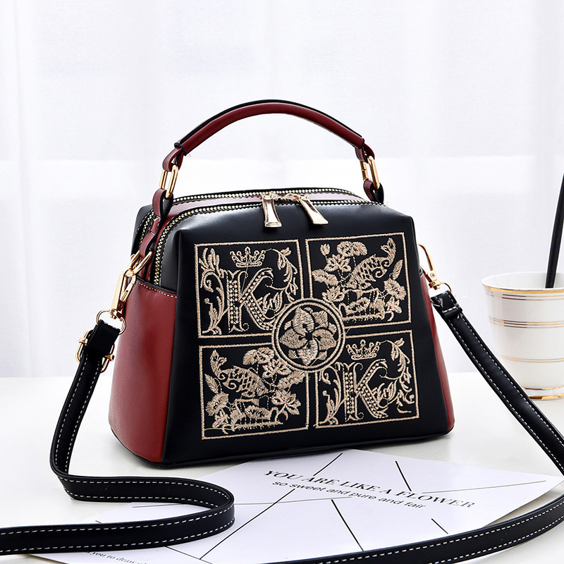 The 2022 new style of fashionable embroidered middle-aged women's handbag is stylish and can be worn diagonally over one shoulder details Picture